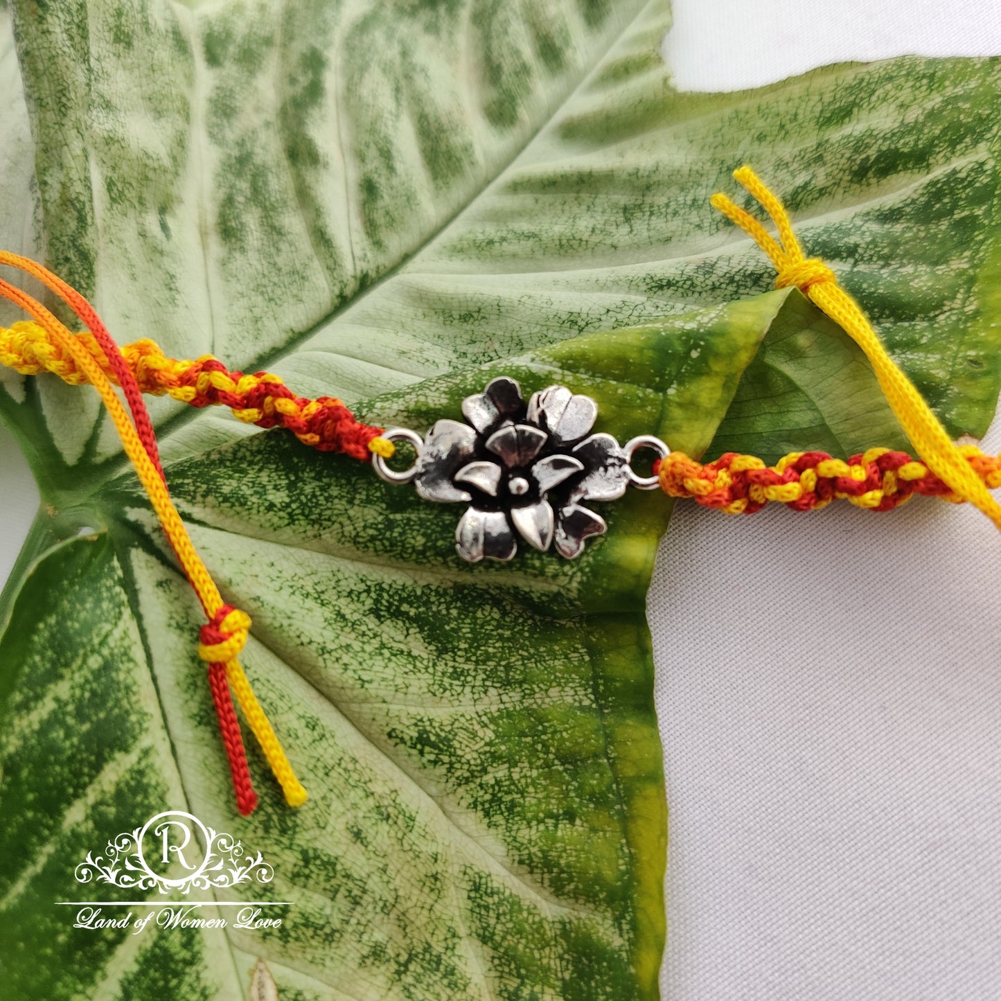 92.5 silver beautiful flower rakhi :rcg112,rcg133 92.5 silver ramala jewelry / ramala collections