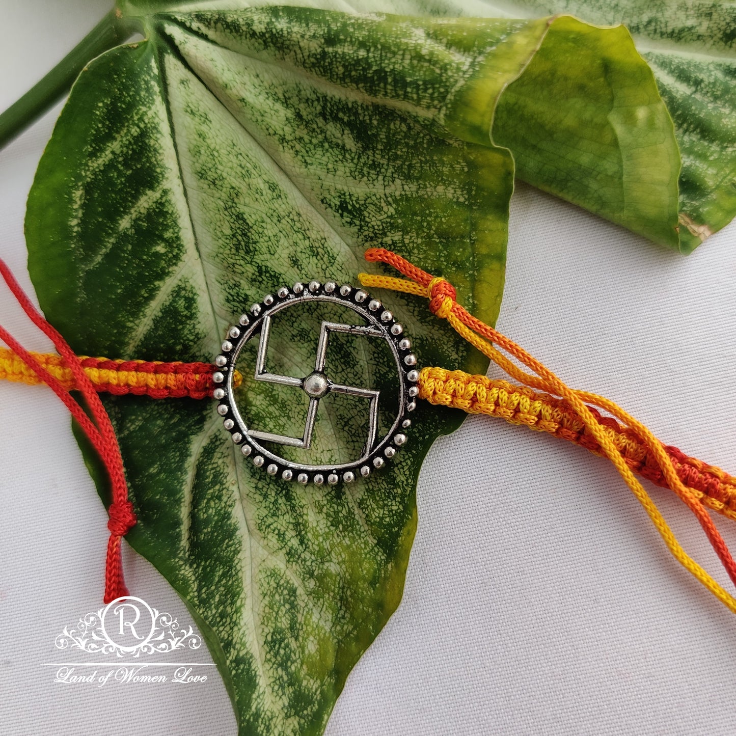 92.5 silver beautiful swastik design rakhi : rcg128 92.5 silver ramala jewelry / ramala collections